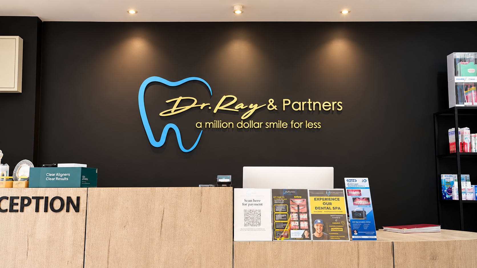 Dr Ray & Partners logo wall above the reception counter