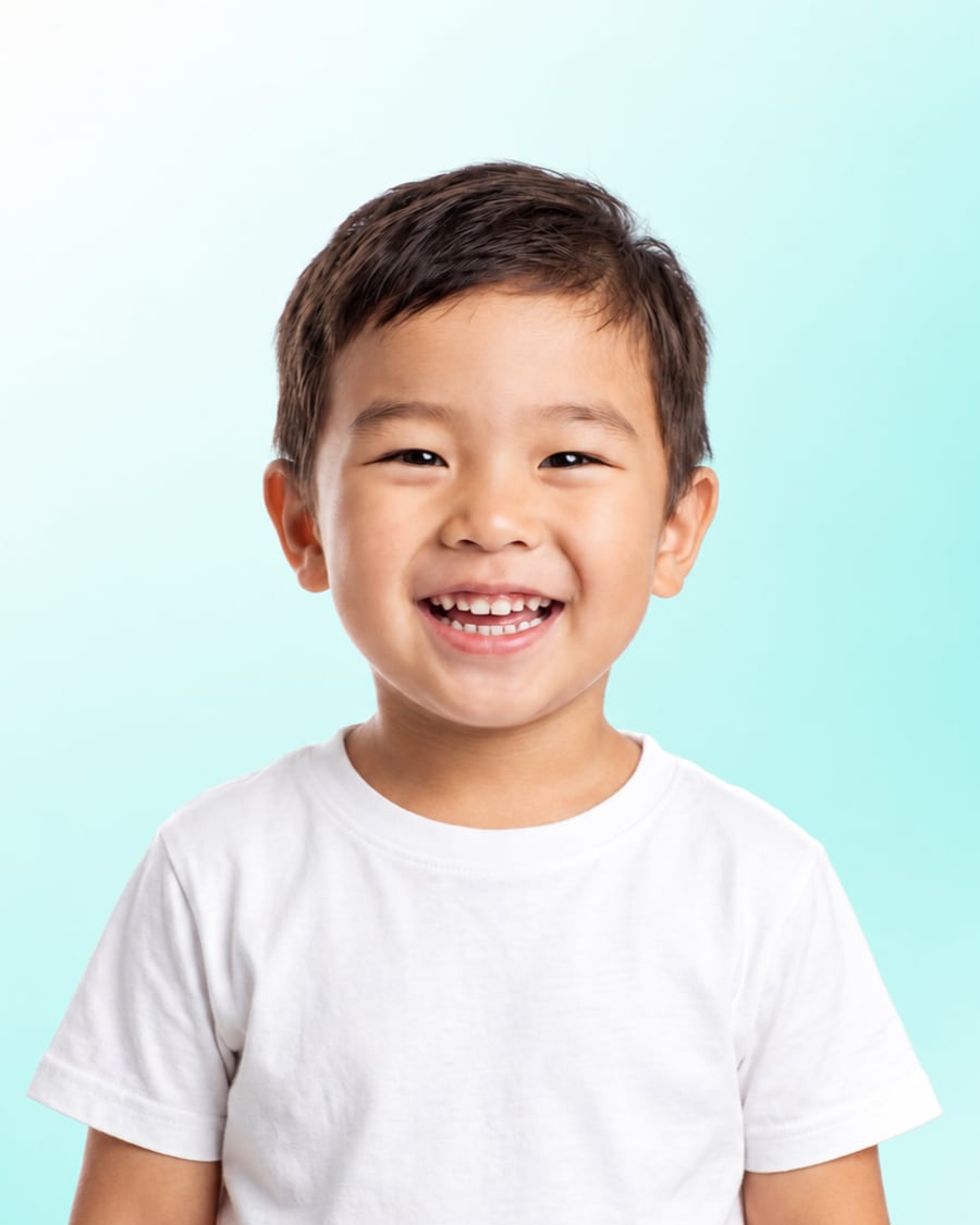 Smiling young child with healthy teeth at Dr Ray & Partners Dental